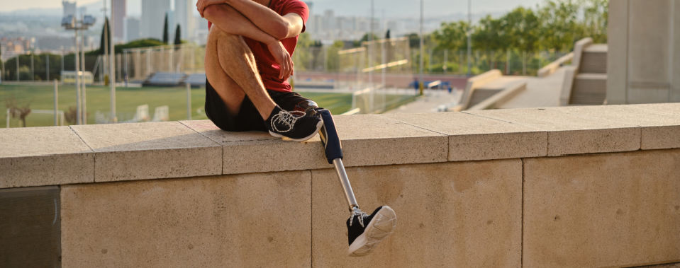 young man with a disability relaxing while sitting